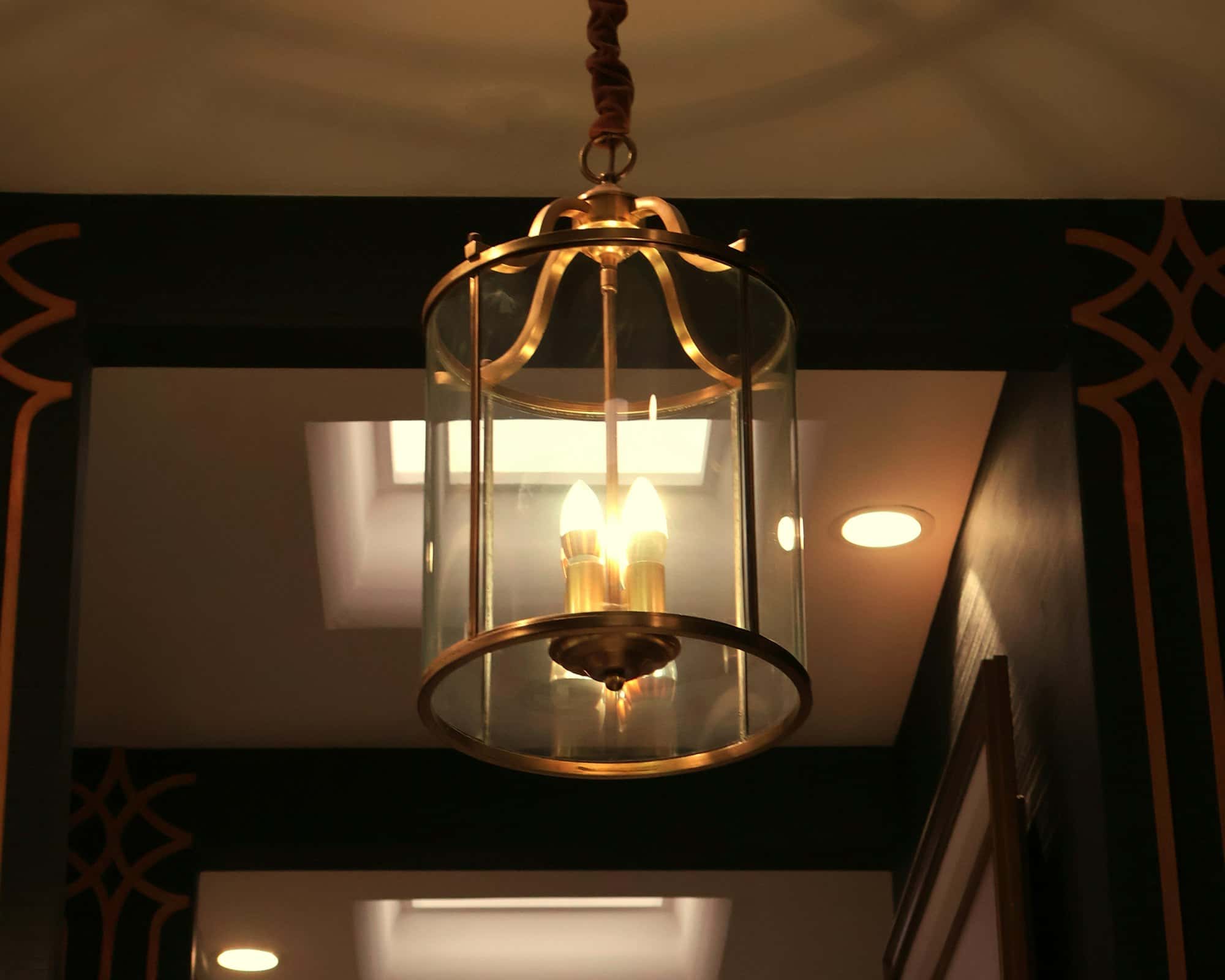 A decorative brass lantern hanging from the ceiling
