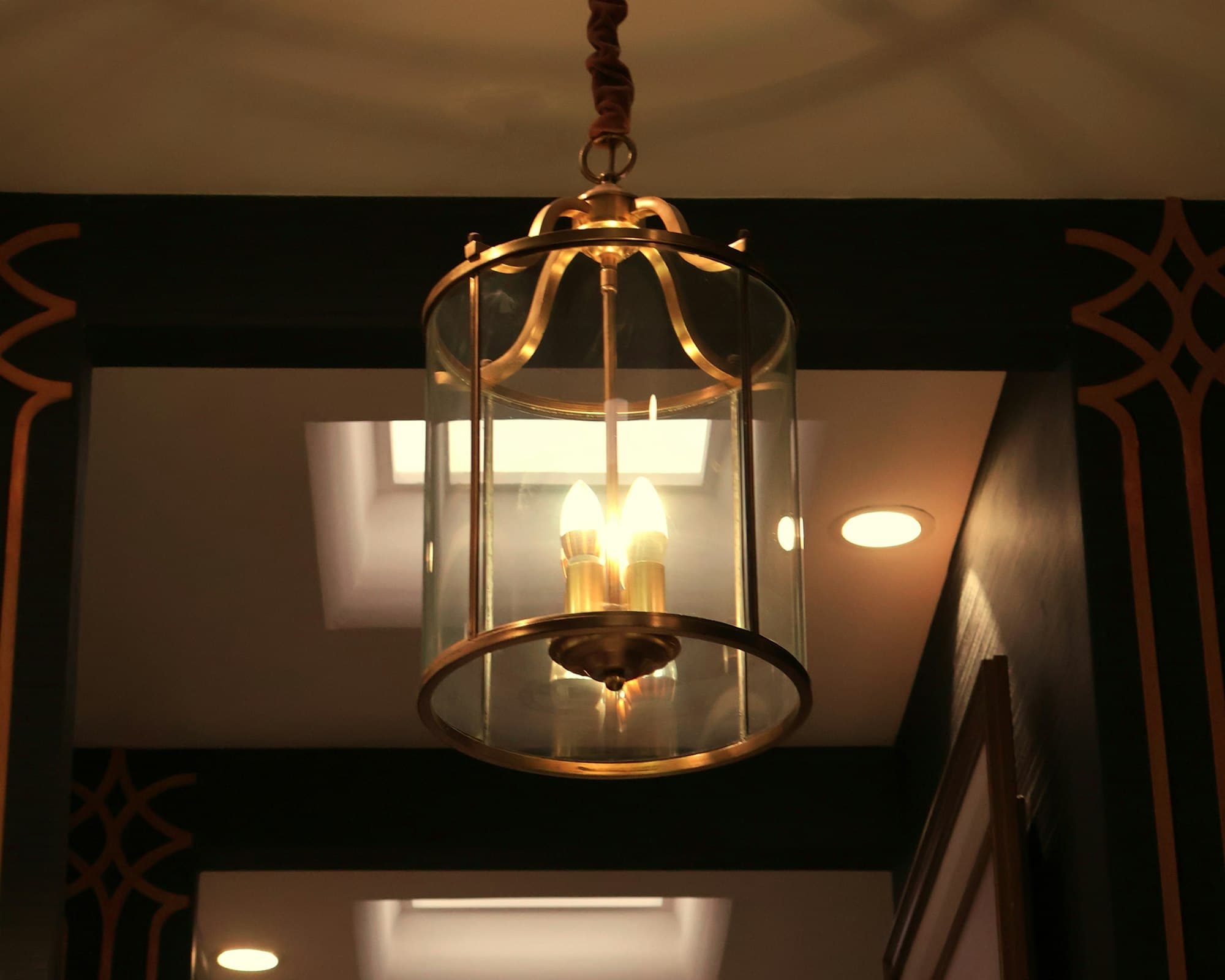 A decorative brass lantern hanging from the ceiling